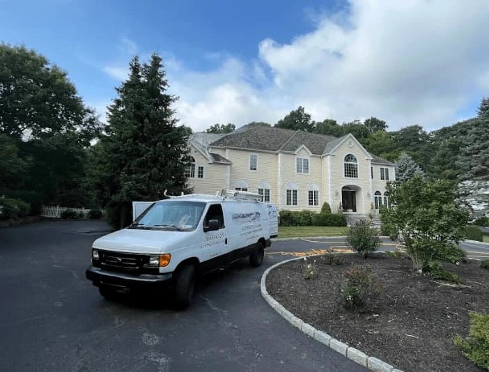 Stow Power Washing technician performing thorough gutter cleaning service in Stow