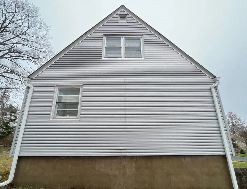 Stow Power Washing technician performing detailed house washing in Stow residential area